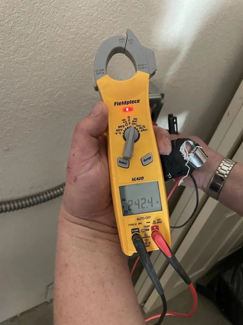 Voltage testing with clamp meter during Generator Installation in North Miami